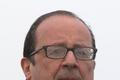 Zmoknutý Francois Hollande.