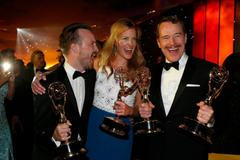 Aaron Paul, Anna Gunn and Bryan Cranston attend the Governors Ball for the 66th Primetime Emmy Awards in Los Angeles
