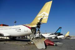 A damaged aircraft is pictured after shelling at Tripoli International Airport