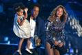 Jay-Z presents the Video Vanguard Award to Beyonce as he holds their daughter Ivy Blue during the 2014 MTV Video Music Awards in Inglewood