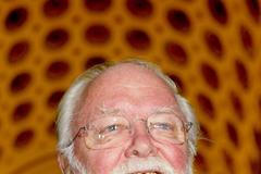 File picture shows British filmmaker Sir Richard Attenborough arriving at a reception hosted by Britain's Queen Elizabeth II at Buckingham Palace in London