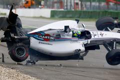 Williams Formula One driver Massa of Brazil crashes with his car in the first corner after the start of the German F1 Grand Prix at the Hockenheim racing circuit