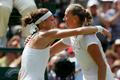 Petra Kvitova of the Czech Republic embraces Lucie Safarova of the Czech Republic after defeating her in their women's singles semi-final tennis match at the Wimbledon Tennis Championships, in London