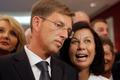 Miro Cerar, leader of the SMC, listens to his partner Vesna Arnsek after he seeing preliminary results of elections in Ljubljana