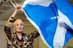 Designer Vivienne Westwood poses with a Scottish flag backstage before the presentation of her Vivienne Westwood Red Label Spring/Summer 2015 collection during London Fashion Week