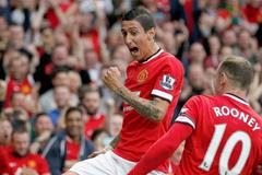 Manchester United's Di Maria celebrates with teammate Rooney after scoring a goal against Queens Park Rangers during their English Premier League soccer match at Old Trafford in Manchester