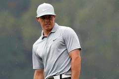 Rory McIlroy of Northern Ireland looks over his chip shot on the fourth hole during the second round of the PGA Championship at Valhalla Golf Club in Louisville