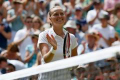 Petra Kvitova of the Czech Republic reacts after defeating Lucie Safarova of the Czech Republic in their women's singles semi-final tennis match at the Wimbledon Tennis Championships, in London