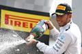 Mercedes Formula One driver Hamilton of Britain celebrates with champagne after winning the Italian F1 Grand Prix in Monza