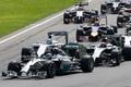 Mercedes Formula One driver Rosberg of Germany leads the race ahead of McLaren Formula One driver Magnussen of Denmark  during the Italian F1 Grand Prix in Monza