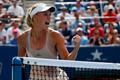 Caroline Wozniacki of Denmark celebrates a point against Maria Sharpova of Russia during their match at the 2014 U.S. Open tennis tournament in New York