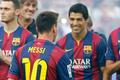 FC Barcelona's player Suarez smiles to teammate Messi during their team presentation at Nou Camp stadium in Barcelona