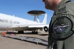 The patch of the NATO AWACS aircraft is seen attached to the uniform of an officer before boarding for a surveillance flight over Romania from the AWACS air base in Geilenkirchen near the German-Dutch