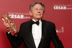Roman Polanski poses with Best Director award for "La Venus A La Fourrure" at the 39th Cesar Awards ceremony in Paris