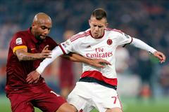 AS Roma's Maicon challenges AC Milan's Menez during their Italian Serie A soccer match in Rome