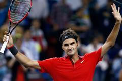 Roger Federer of Switzerland celebrates winning his men's singles semi-final match against Novak Djokovic of Serbia at the Shanghai Masters tennis tournament in Shanghai