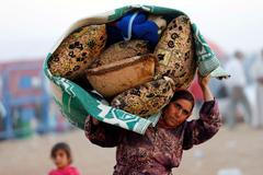 Kurdští uprchlíci u syrských hranic