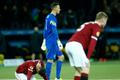 Sparta Prague players stand dejected after BSC Young Boys scored a second goal during Europa League match in Bern