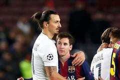 Paris St Germain's Zlatan Ibrahimovic embraces Barcelona's Lionel Messi after their Champions League Group F soccer match at the Nou Camp stadium in Barcelona