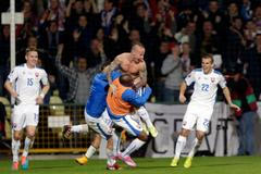 Stoch of Slovakia celebrates his goal against Spain with team mates during their Euro 2016 qualification soccer match at the MSK stadium in Zilina