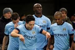 Manchester City's Nasri celebrates after scoring against AS Roma during their Champions League Group E soccer match at the Olympic stadium in Rome