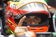 Force India Formula One driver Sergio Perez of Mexico gestures in his car during the second practice session of the Singapore F1 Grand Prix at the Marina Bay street circuit in Singapore