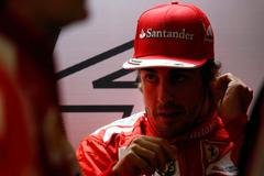 Ferrari Formula One driver Fernando Alonso of Spain prepares before the third practice session of the Chinese F1 Grand Prix at the Shanghai International circuit