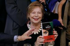 French writer Salvayre poses after she received the French literary prize Prix Goncourt at the Drouant restaurant in Paris