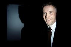 Artist Duncan Campbell poses with his work "Sigmar" after winning the Turner Prize at the Tate Britain Gallery in London