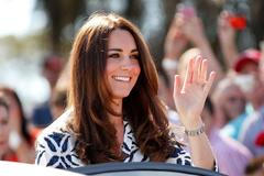 Catherine, Duchess of Cambridge, smiles as she arrives at the Blue Mountains suburb of Winmalee, during visit with her husband, Britain's Prince William, west of Sydney