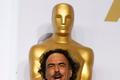 "Birdman" Director Alejandro Inarritu poses with the Oscars for Best Director, Best Original Screenplay and Best Picture backstage at the 87th Academy Awards in Hollywood