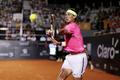 Rafael Nadal of Spain returns to Pablo Cuevas of Uruguay during their men's singles tennis match at the Rio Open tournament in Rio de Janeiro