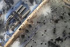 Still image taken from handout aerial footage shot by a drone shows the shell craters at the Sergey Prokofiev International Airport damaged by shelling during fighting between pro-Russian separatists