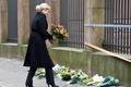 Danish PM Thorning-Schmidt places flowers in front of the synagogue in Krystalgade in Copenhagen