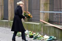 Danish PM Thorning-Schmidt places flowers in front of the synagogue in Krystalgade in Copenhagen