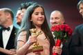 The niece of Iranian film director Panahi appears on stage with jury members and prize winners during awards ceremony at 65th Berlinale International Film Festival in Berlin