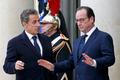 French President Francois Hollande welcomes former French President Nicolas Sarkozy, head of the French conservative party UMP party, at the Elysee Palace before attending a solidarity march in the st