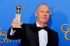 Michael Keaton poses backstage with his award for Best Actor in a Motion Picture, Musical or Comedy for his role in "Birdman" at the 72nd Golden Globe Awards in Beverly Hills