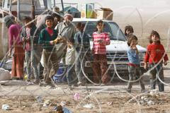 Kurdští uprchlíci na syrsko-turecké hranici.