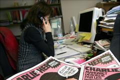 Novinářka v redakci týdeníku Charlie Hebdo