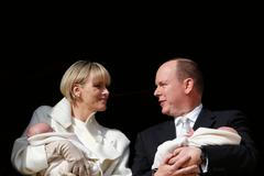 Prince Albert II of Monaco and his wife Princess Charlene hold their twins Prince Jacques and Princess Gabriella as they stand at the Palace Balcony during the official presentation of the Monaco's ne