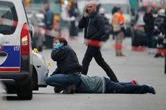 Policejní fotograf na místě střelby v pařížském sídle Charlie Hebdo