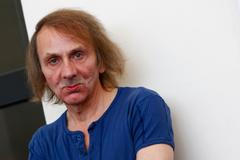 Michel Houellebecq poses during the photo call for the movie "Near Death Experience" at the 71st Venice Film Festival
