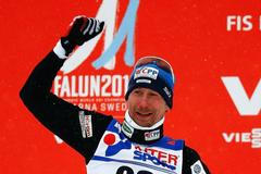 Bauer of the Czech Republic celebrates after the men's cross country 50 km mass start classic race at the Nordic World Ski Championships in Falun