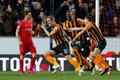 Football: Michael Dawson celebrates with team mates after scoring the first goal for Hull