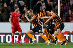 Football: Michael Dawson celebrates with team mates after scoring the first goal for Hull