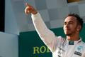 Mercedes Formula One driver Lewis Hamilton of Britain celebrates his victory on the podium after the Australian F1 Grand Prix at the Albert Park circuit in Melbourne
