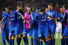 Juventus players celebrate after their team's qualification for the semi-final of the Champions League at the end of their quarter-final second leg soccer match against Monaco at the Louis II stadium