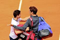 Tennis: Men's Singles - Switzerland's Roger Federer appeals to security after a spectator tries to take a "selfie" on court after his win