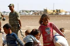 Kurdští uprchlíci na syrsko-turecké hranici.